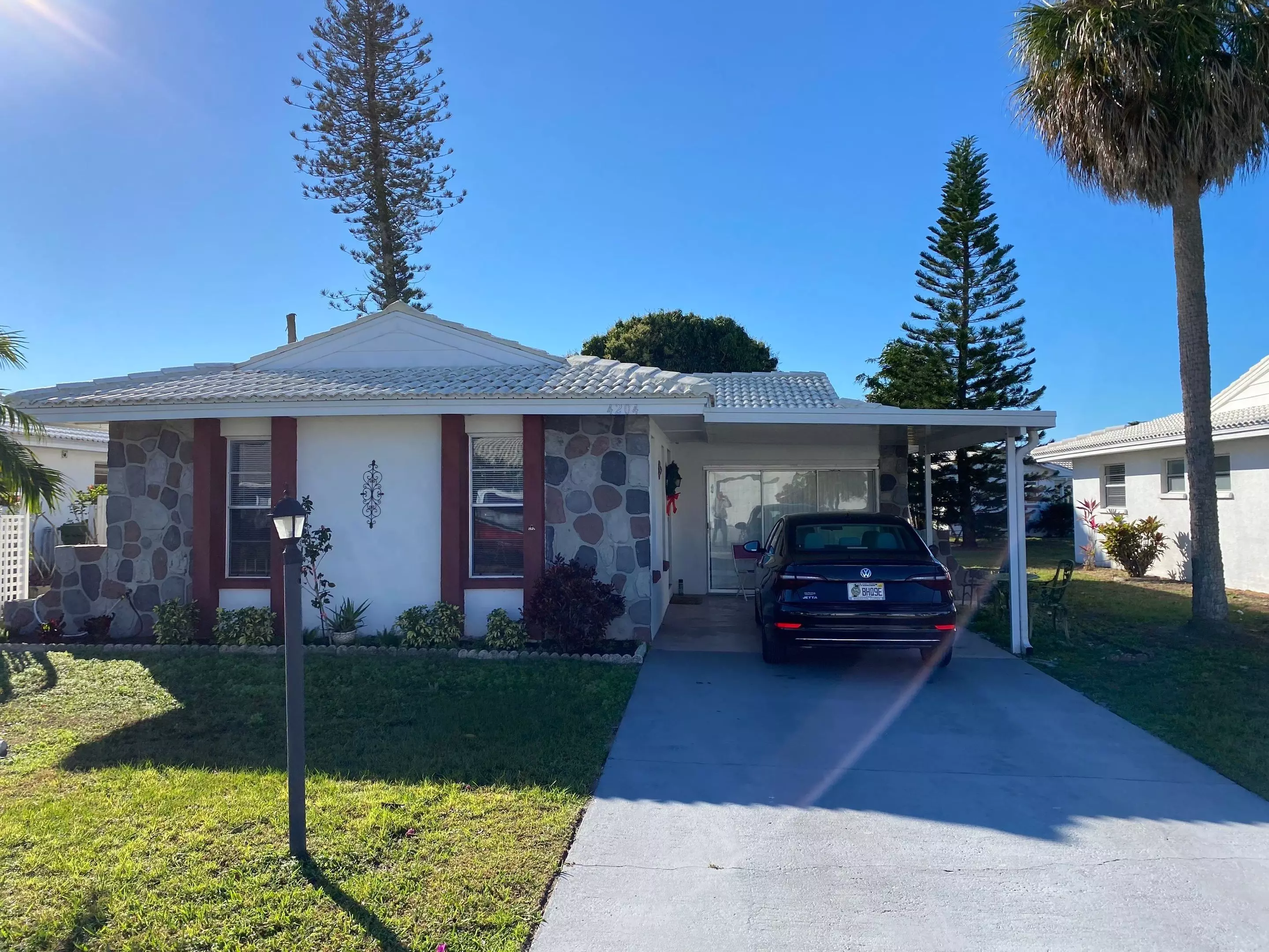 Before and after pictures of new plantings and mulch donated by Pestguard Commercial.